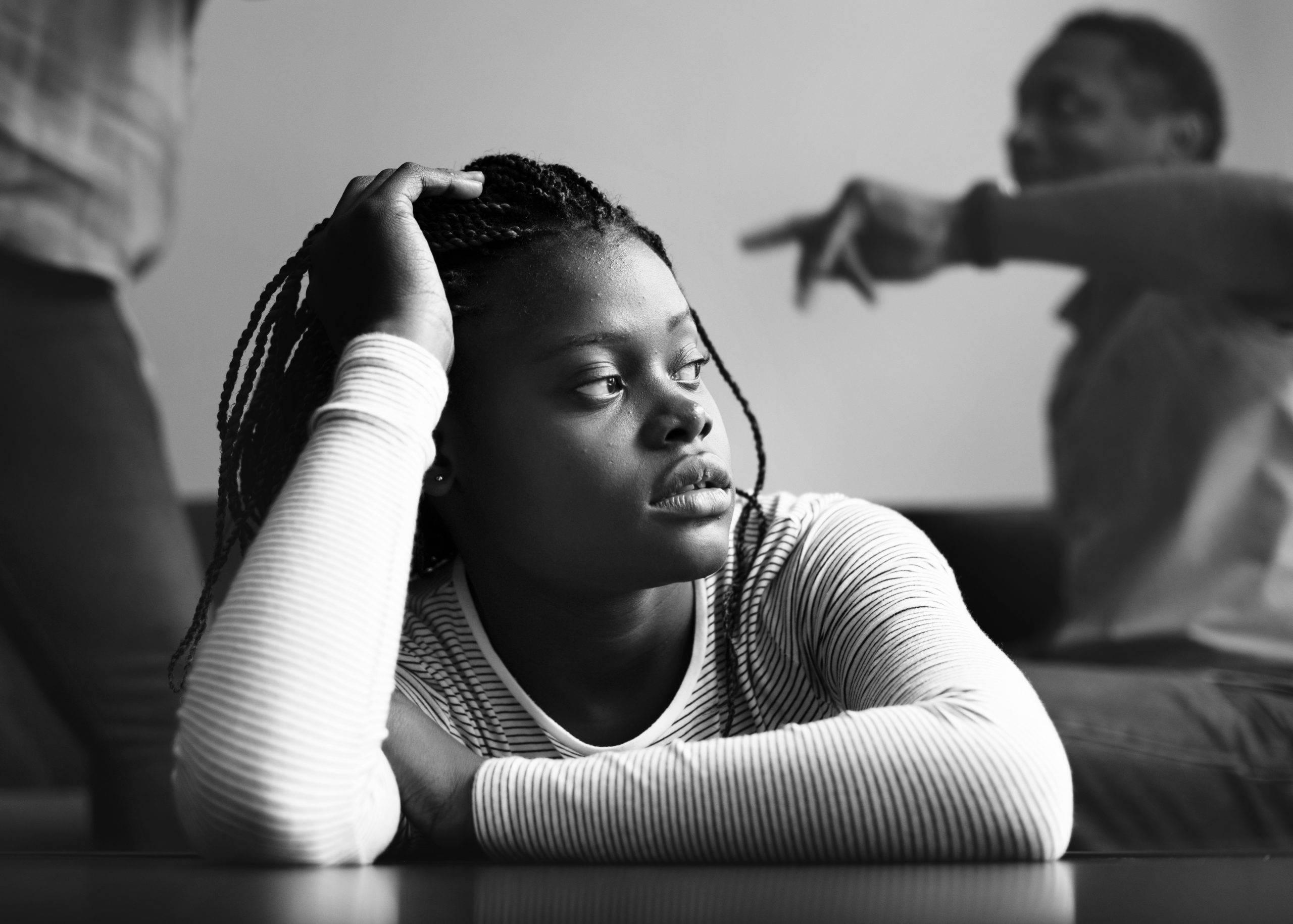 Young, depressed girl in an abusive home during covid-19 lockdown